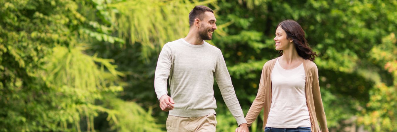  A couple walking hand in hand at a park during summer season enjoying life after rehab in Monmouth Junction